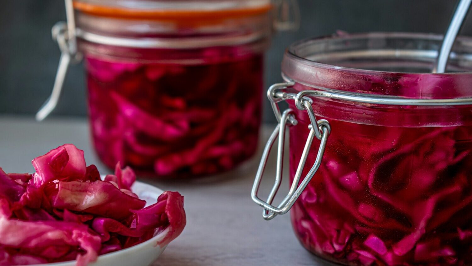 red liquid in clear glass jar